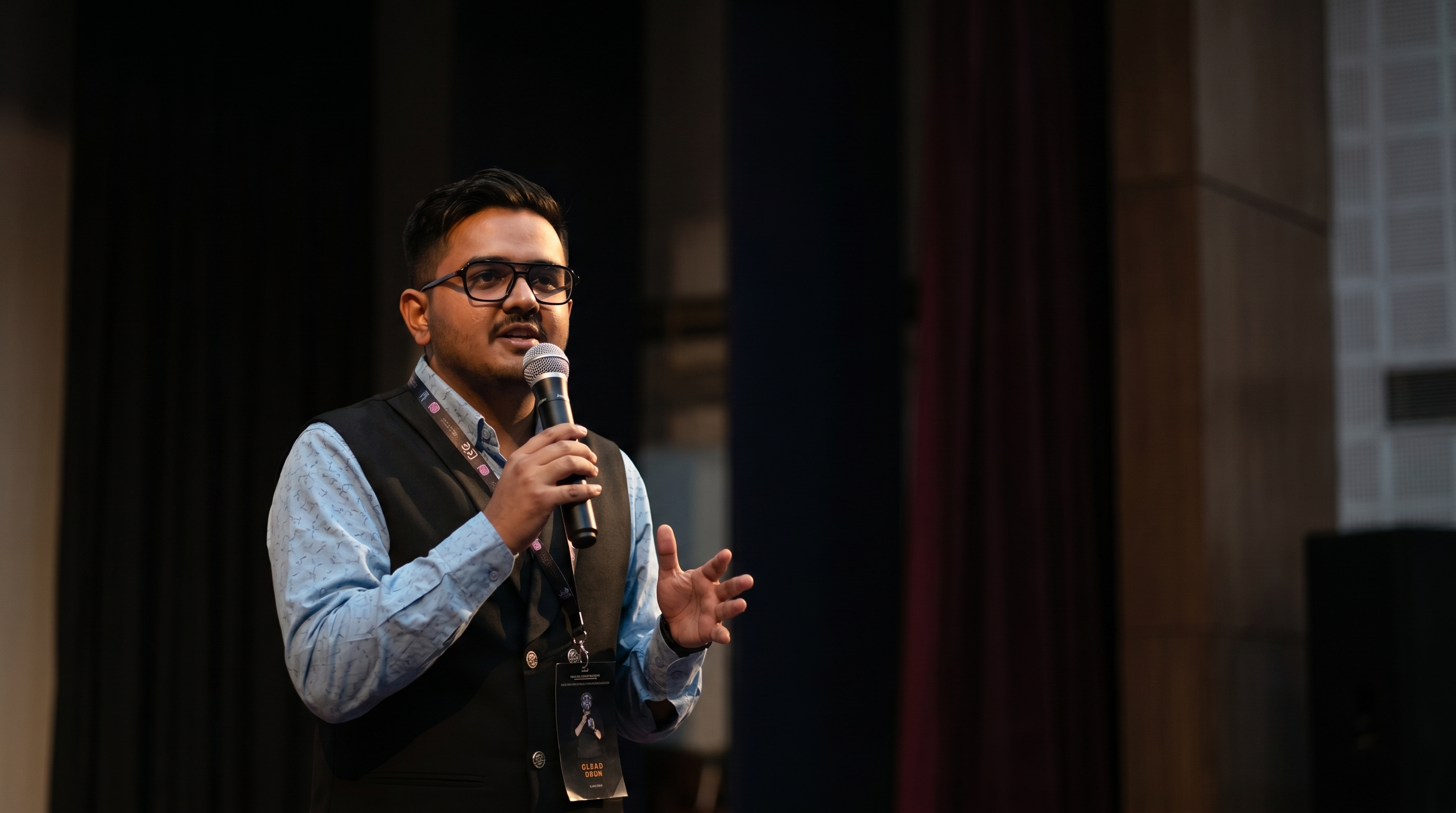 Sagar Shah at work, lit by code on a monitor